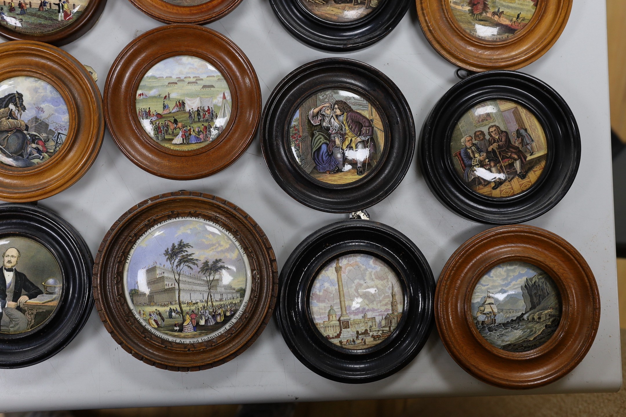 A collection of 19th century Prattware pot lids (23)